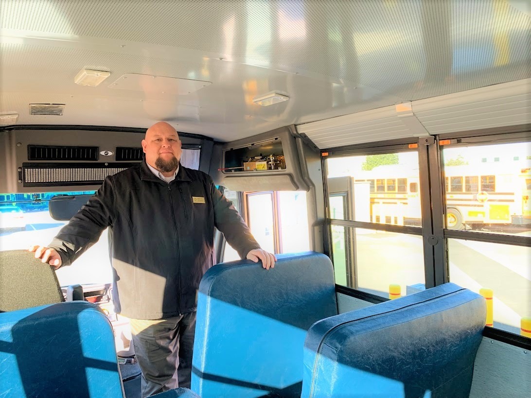 person standing inside bus