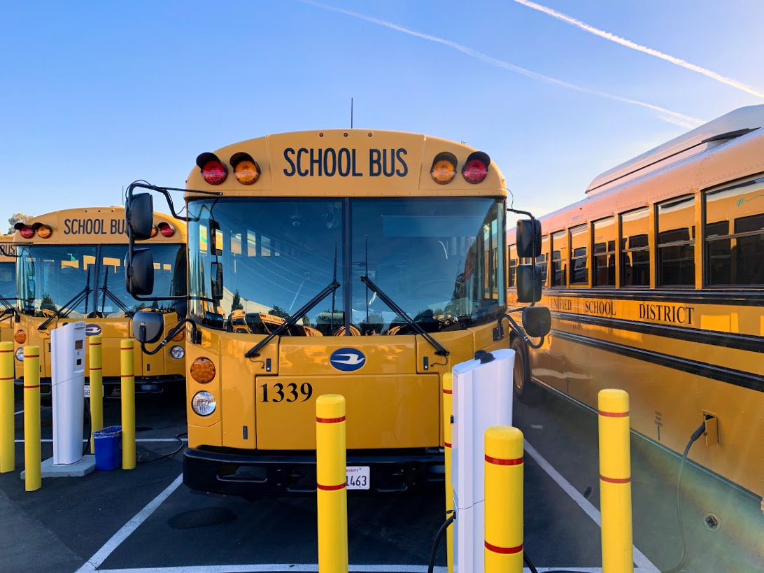school buses parked at charge stations