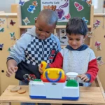Two boys interacting in Transitional Kindergarten